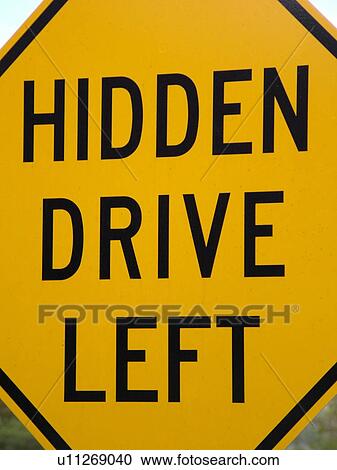 Stock Image -  road sign, Hidden Drive Left, warning sign, . Fotosearch