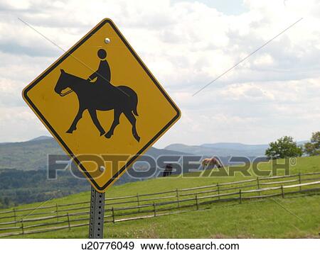 Stock Photo -  road sign, horse crossing, horseback riding, warning sign. Fotosearch