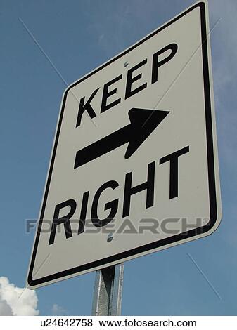 Stock Photo -  road sign, Keep Right sign against a blue sky, regulatory sign, . Fotosearch