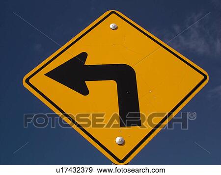 Road Sign Sharp Turn Left Sign Against A Blue Sky Sharp Curve