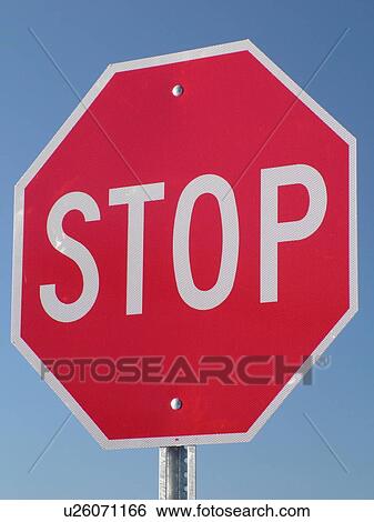 Stock Photograph -  road sign, Stop Sign against a blue sky, close-up, . Fotosearch