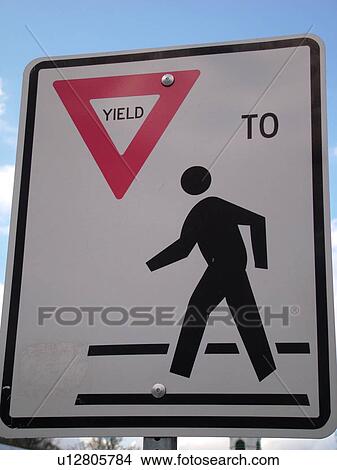 Picture -  road sign, Yield to Pedestrian sign, pedestrian crossing sign, regulatory sign. Fotosearch