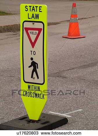 Stock Image -  road sign, Yield to Pedestrian sign, pedestrian crossing sign on road, crosswalk. Fotosearch