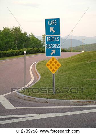 Stock Photo -  road signs, Rest Area, directions for cars and trucks, buses and RVs, yellow reflector sign. Fotosearch