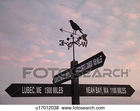 Stock Photo -  Rugby, ND, North Dakota, Geographical Center of the Continent, North America, weathervane, mileage sign. Fotosearch