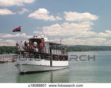 Stock Image -  Skaneateles, NY, New York, Finger Lakes Region, Skaneateles Lake, Mid Lakes Navigation Company, excursion, tour boat, The Judge Ben Wiles sightseeing dinner cruise boat. Fotosearch