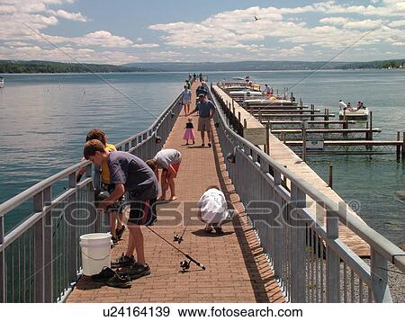Stock Photo -  Skaneateles, NY, New York, Finger Lakes Region, Skaneateles Lake, dock, marina, fishing. Fotosearch
