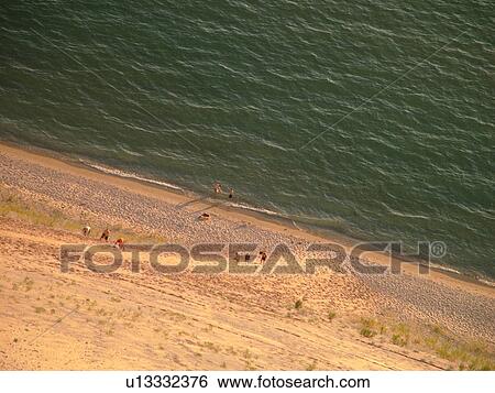 Sleeping Bear Sand Dunes National Lakeshore, MI, Michigan, Lake Michigan, from overlook, Pierce Stocking Scenic Drive, dunes, people climbing the dune View Large Photo Image Stock Photograph - Sleeping Bear Sand Dunes National Lakeshore, MI, Michigan, Lake Michigan, from overlook, Pierce Stocking Scenic Drive, dunes, people climbing the dune. Fotosearch
