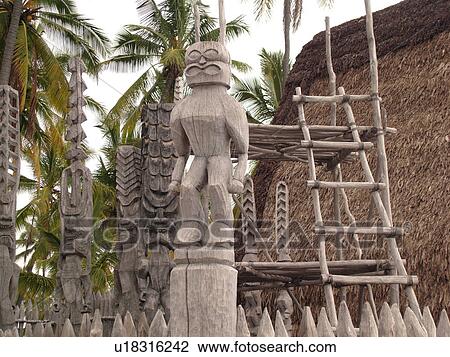 Stock Image -  South Kona, Big Island, Island of Hawaii, HI, Hawaii, Kona Coast, Leeward, West Coast, Captain Cook, Honaunau, Pu'uhonua O Honaunau National Historical Park, Place of Refuge, Kii, carved wooden images of Gods, guardians, Temple. Fotosearch