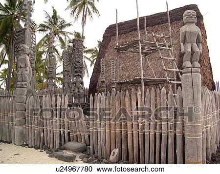 Stock Image -  South Kona, Big Island, Island of Hawaii, HI, Hawaii, Kona Coast, Leeward, West Coast, Captain Cook, Honaunau, Pu'uhonua O Honaunau National Historical Park, Place of Refuge, Kii, carved wooden images of Gods, guardians, Temple. Fotosearch