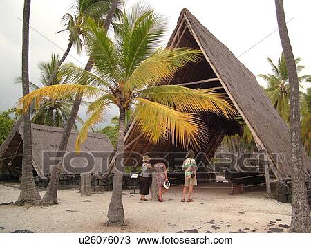 Stock Image -  South Kona, Big Island, Island of Hawaii, HI, Hawaii, Kona Coast, Leeward, West Coast, Captain Cook, Honaunau, Pu'uhonua O Honaunau National Historical Park, Place of Refuge, Halau, thatched A frame structures. Fotosearch