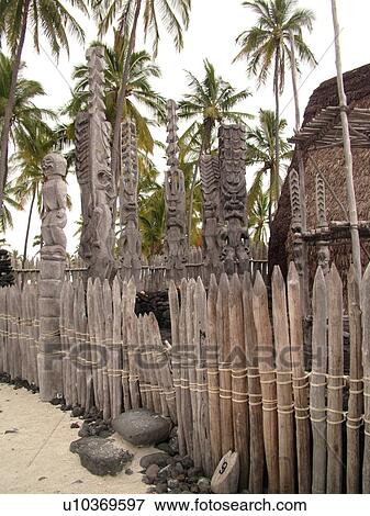 Stock Photo -  South Kona, Big Island, Island of Hawaii, HI, Hawaii, Kona Coast, Leeward, West Coast, Captain Cook, Honaunau, Pu'uhonua O Honaunau National Historical Park, Place of Refuge, Kii, carved wooden images of Gods, guardians, Temple. Fotosearch
