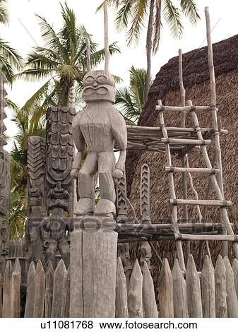 Stock Photo -  South Kona, Big Island, Island of Hawaii, HI, Hawaii, Kona Coast, Leeward, West Coast, Captain Cook, Honaunau, Pu'uhonua O Honaunau National Historical Park, Place of Refuge, Kii, carved wooden images of Gods, guardians, Temple. Fotosearch