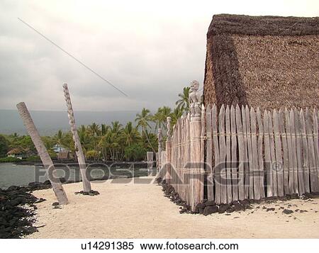 Stock Photography -  South Kona, Big Island, Island of Hawaii, HI, Hawaii, Kona Coast, Leeward, West Coast, Captain Cook, Honaunau, Pu'uhonua O Honaunau National Historical Park, Place of Refuge, Kii, carved wooden images of Gods, guardians, Temple. Fotosearch