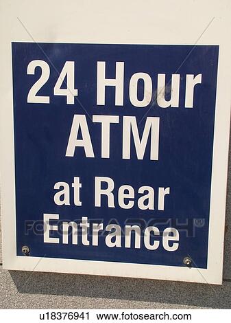 Stock Image -  street sign, 24 Hour ATM at Rear Entrance. Fotosearch