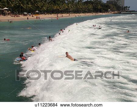 Picture -  Waikiki, Honolulu, Oahu, HI, Hawaii, Queen's Surf Beach, boogie boarding. Fotosearch