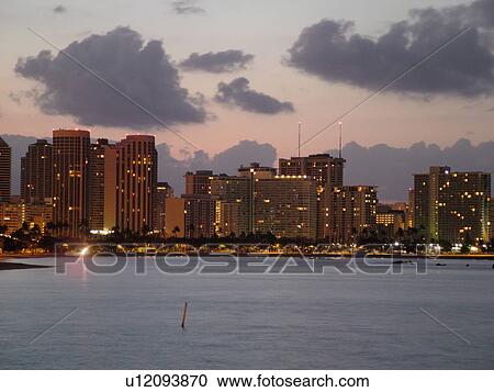 Stock Image -  Waikiki, Honolulu, Oahu, HI, Hawaii, Waikiki from Kewalo Basin Park, skyline, beachfront, morning. Fotosearch