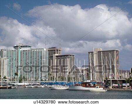 Stock Image -  Waikiki, Honolulu, Oahu, HI, Hawaii, Ala Wai Yacht Harbor, Hawaiian Prince Hotel, Hilton Hawaiian Village, marina. Fotosearch