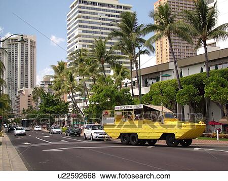Stock Photo -  Waikiki, Honolulu, Oahu, HI, Hawaii, Kalakaua Avenue, Land and Sea Tours. Fotosearch