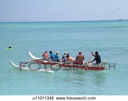 Stock Photograph -  Waikiki, Honolulu, Oahu, HI, Hawaii, Central Waikiki Beach, outrigger sea canoe. Fotosearch