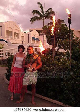 Wailea, Maui, HI, Hawaii, South Maui, The Fairmont Kea Lani Maui Resort, lady posing with the torch lighter View Large Photo Image Stock Image - Wailea, Maui, HI, Hawaii, South Maui, The Fairmont Kea Lani Maui Resort, lady posing with the torch lighter. Fotosearch