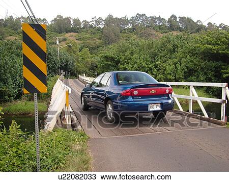 Stock Image -  Wainiha, Princeville, Kauai, HI, Hawaii, North Shore, Wainiha River, Kuhio Highway, one lane bridge. Fotosearch