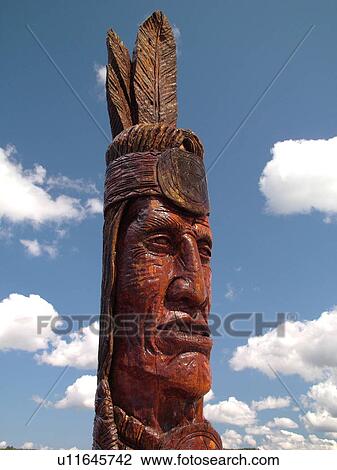 Stock Image -  Wakefield, MI, Michigan, Indian Sculpture Nee-Gaw-Nee-Gaw-Bow Leading Man, carver Peter Wolfe Toth. Fotosearch