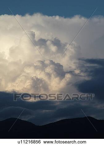 Stock Photograph -  Waterbury, VT, Vermont, clouds, Cumulonimbus Incus. Fotosearch