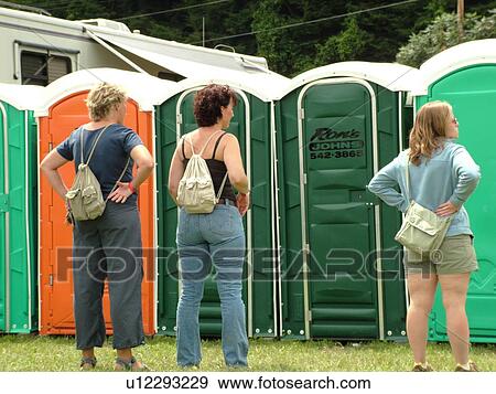 Stock Photo -  Windsor, VT, Vermont, Harpoon Championships of New England Barbecue, Harpoon Brewery, Ron's Johns, port-o-lets, bathrooms, women waiting to use the bathroom. Fotosearch