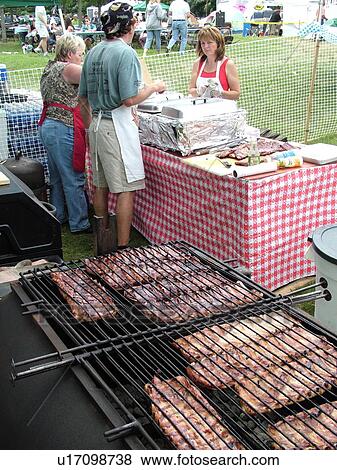 Stock Photo -  Windsor, VT, Vermont, Harpoon Championships of New England Barbecue, Harpoon Brewery, pork ribs, grill. Fotosearch