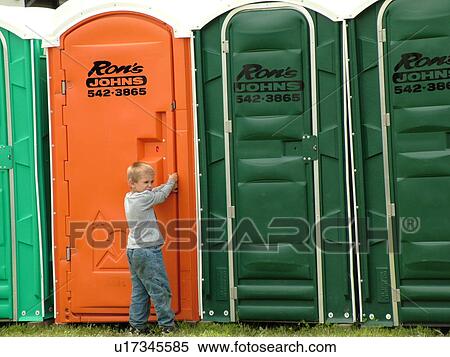 Stock Photography -  Windsor, VT, Vermont, Harpoon Championships of New England Barbecue, Harpoon Brewery, Ron's Johns, port-o-lets, bathrooms, young boy waiting to use the port-o-let. Fotosearch