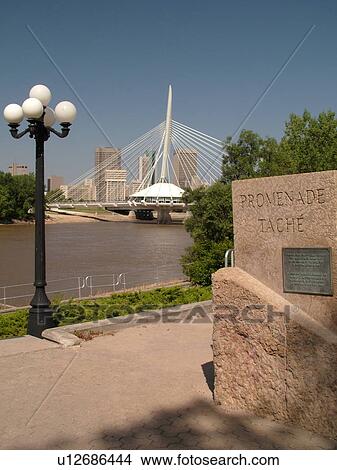 Picture -  Winnipeg, Canada, MB, Manitoba, Provencher Bridge & Esplanade Riel Pedestrian Bridge, Red River, skyline. Fotosearch