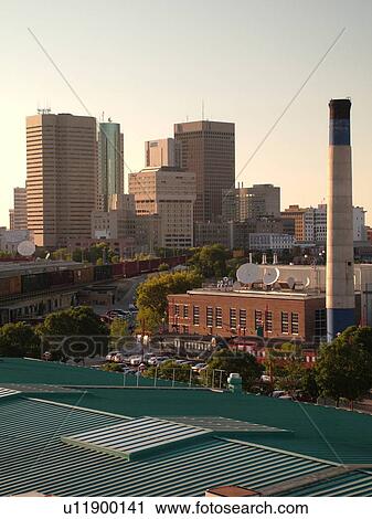 Stock Image -  Winnipeg, Canada, MB, Manitoba, Downtown, from The Forks, junction of Red River and Assiniboine River. Fotosearch
