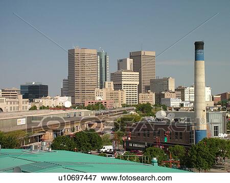 Stock Photo -  Winnipeg, Canada, MB, Manitoba, Downtown, skyline from The Forks, junction of Red River and Assiniboine River. Fotosearch