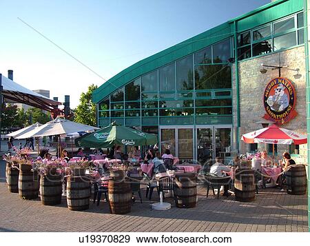 Winnipeg, Canada, MB, Manitoba, Downtown, outdoor cafT, Muddy Waters Smokehouse, Meeting Place, The Forks, junction of Red River and Assiniboine River View Large Photo Image Stock Photo - Winnipeg, Canada, MB, Manitoba, Downtown, outdoor cafT, Muddy Waters Smokehouse, Meeting Place, The Forks, junction of Red River and Assiniboine River. Fotosearch