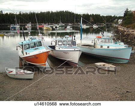 Stock Photo -  Winter Harbor, ME, Maine, Mount Desert Island, Atlantic Ocean, Frenchman Bay, lobster boats, low tide. Fotosearch