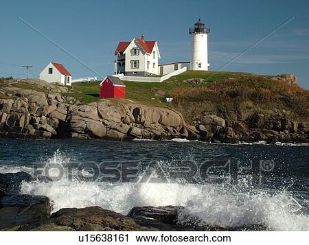 Stock Image -  York Beach, ME, Maine, Cape Neddick Nubble Light, Lighthouse, waves crashing along the rocky coastline. Fotosearch
