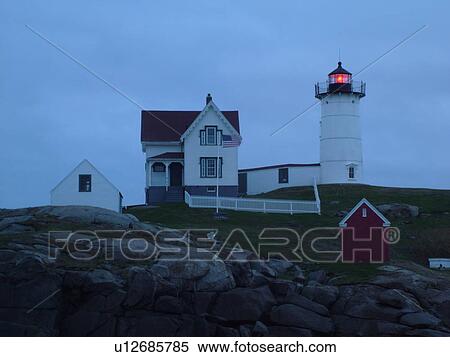 Stock Photography -  York Beach, ME, Maine, Cape Neddick Nubble Light, Lighthouse, morning, dawn. Fotosearch