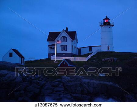 Stock Photography -  York Beach, ME, Maine, Cape Neddick Nubble Light, Lighthouse, morning, dawn. Fotosearch