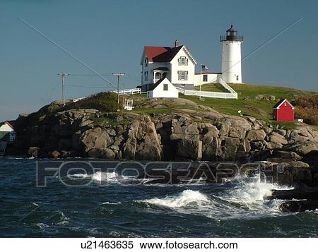 Stock Photography -  York Beach, ME, Maine, Cape Neddick Nubble Light, Lighthouse, waves crashing along the rocky coastline. Fotosearch