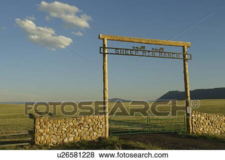 Stock Photo -  Albany County, WY, Wyoming, Sheep Mountain Ranch, prairie, open range, gate. Fotosearch
