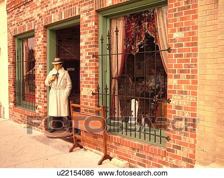 Stock Photograph -  Amelia Island, FL, Florida, Fernandina Beach, downtown, Centre Street, Historic District, Palace Saloon, Gangster statue. Fotosearch