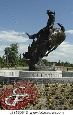 Stock Image -  Cheyenne, WY, Wyoming, Rodeo statue at Cheyenne Frontier Days Old West Museum. Fotosearch