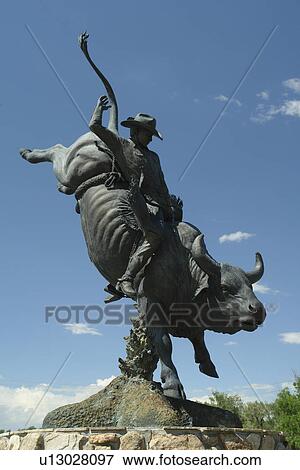 Stock Photo -  Cheyenne, WY, Wyoming, Rodeo statue at Cheyenne Frontier Days Old West Museum. Fotosearch