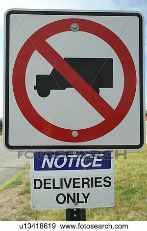 Stock Photo -  Council Bluffs, IA, Iowa, road sign, no trucks, deliveries only, regulatory sign. Fotosearch