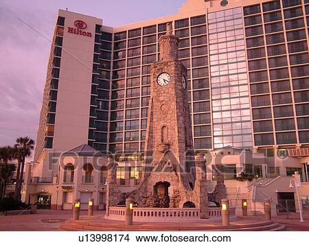 Daytona Beach, FL, Florida, Daytona Beach Shores, Atlantic Ocean, Ocean Walk, clock tower, Hilton Daytona Beach Ocean Front Resort, morning light View Large Photo Image Picture - Daytona Beach, FL, Florida, Daytona Beach Shores, Atlantic Ocean, Ocean Walk, clock tower, Hilton Daytona Beach Ocean Front Resort, morning light. Fotosearch