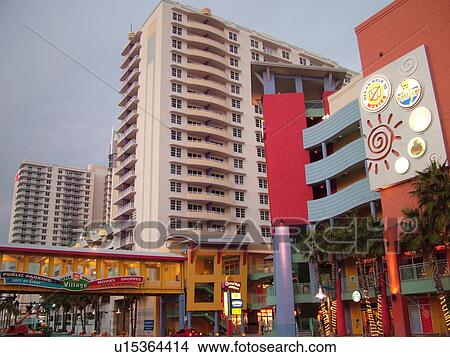 Picture -  Daytona Beach, FL, Florida, Daytona Beach Shores, Atlantic Ocean, Fairfield Resorts at Ocean Walk, Ocean Walk Resorts, Ocean Walk Shoppes, Village, pedestrian bridge, evening. Fotosearch