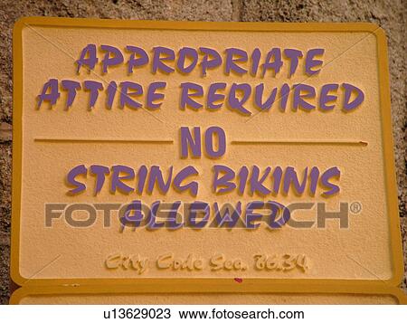 Stock Image -  Daytona Beach, FL, Florida, Daytona Beach Shores, Atlantic Ocean, Ocean Walk, restrictions, signs, appropriate attire required, no string bikinis allowed. Fotosearch