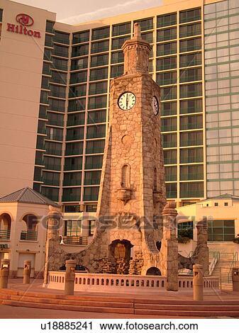 Stock Image -  Daytona Beach, FL, Florida, Daytona Beach Shores, Atlantic Ocean, Ocean Walk, clock tower, Hilton Daytona Beach Ocean Front Resort. Fotosearch