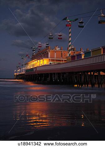 Stock Image -  Daytona Beach, FL, Florida, Daytona Beach Shores, Atlantic Ocean, Main Street Pier & Boardwalk, gondola skyride, evening. Fotosearch